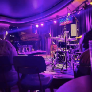 Waiting for the The Adonis Rose Quintet to take the stage at Blue LLama Jazz Club.