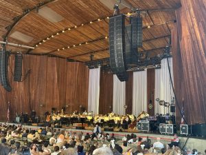 1 A photo of the Blossom Music Center stage with the Cleveland Orchestra on stage.